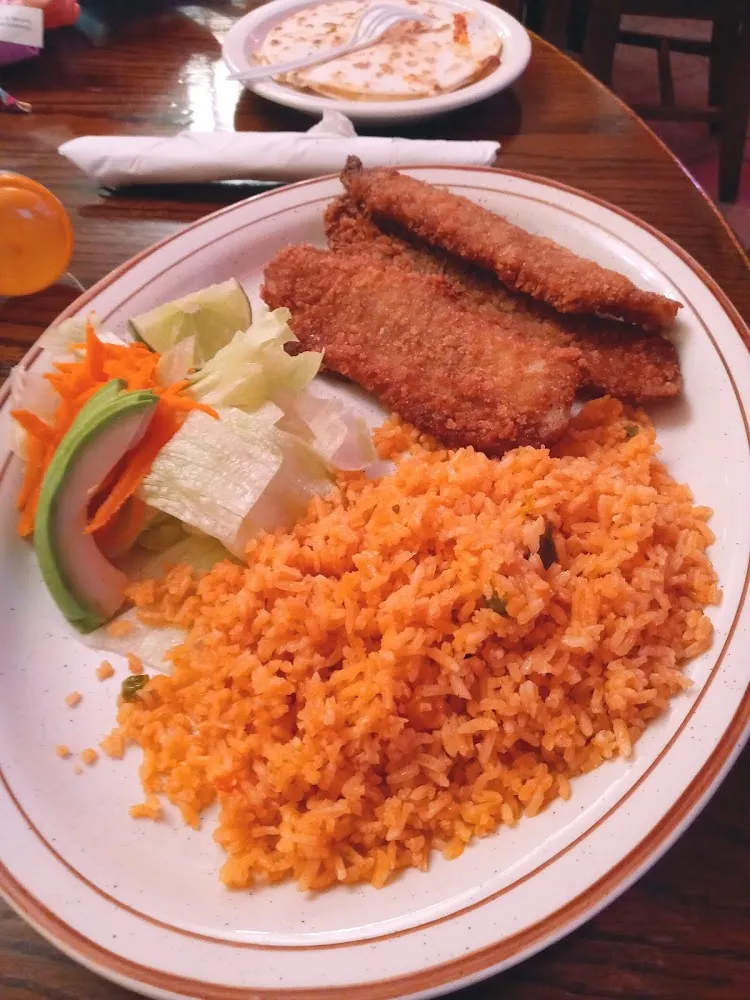 A Mexican Dish with Rice Salad and Fish